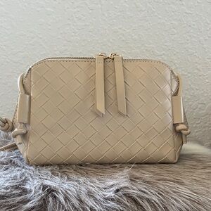 Similar to the Intrecciato Concert Pouch